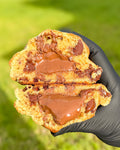 Fresh baked chocolate chip Nutella stuffed cookie with dark chocolate milk chocolate gooey Nutella center gourmet NY style thick soft cookie shipped nationwide Star Cookies Orlando