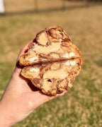 Fresh baked Kinder Bueno stuffed cookie with white and milk chocolate chunks hazelnut cream gourmet NY style thick soft cookie shipped nationwide Star Cookies Orlando
